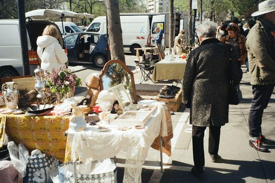 A woman standing next to a table with a mirror on it