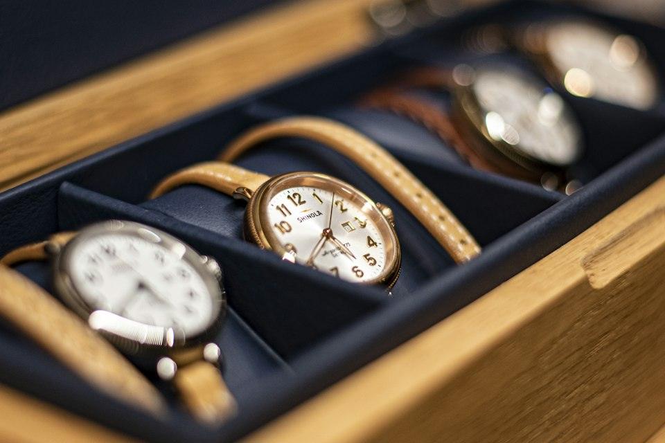 Gold and white analog watch
