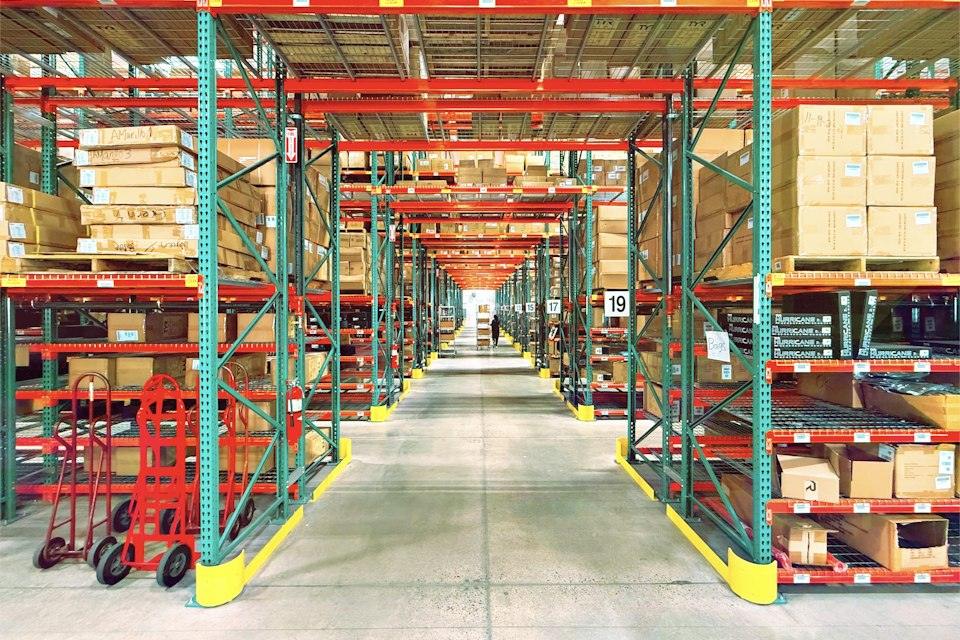 A warehouse is filled with shelves and boxes