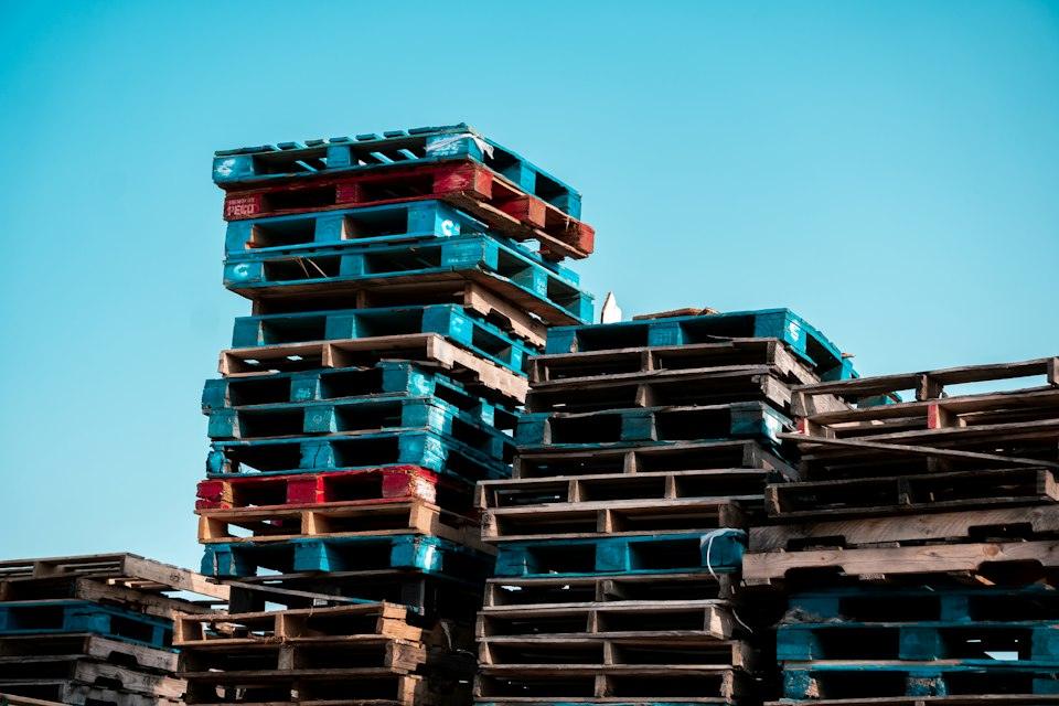 A pile of wooden pallets stacked on top of each other
