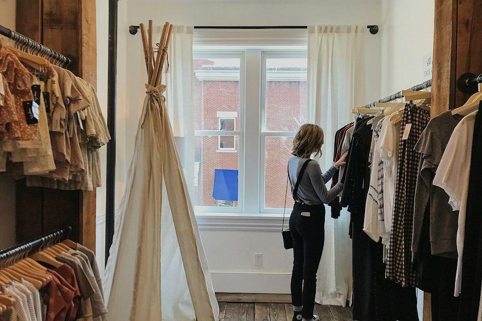 Woman standing selecting clothes