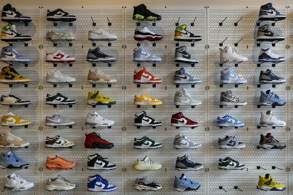 A display of various shoes on a wall
