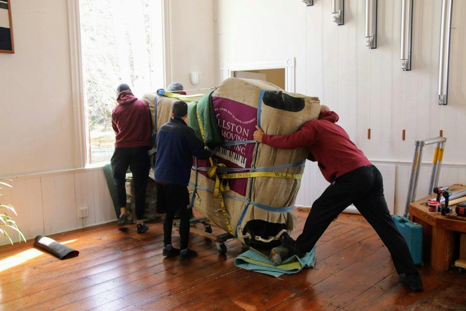 A group of people working on a horse